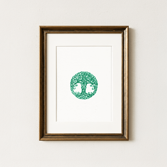A framed artwork featuring a green tree of life design, intricately detailed with swirling branches, centered on a white background, in a wood frame.
