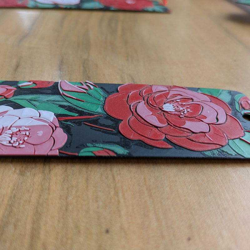 Close up of blush camellia bookmark texture and floral illustration
