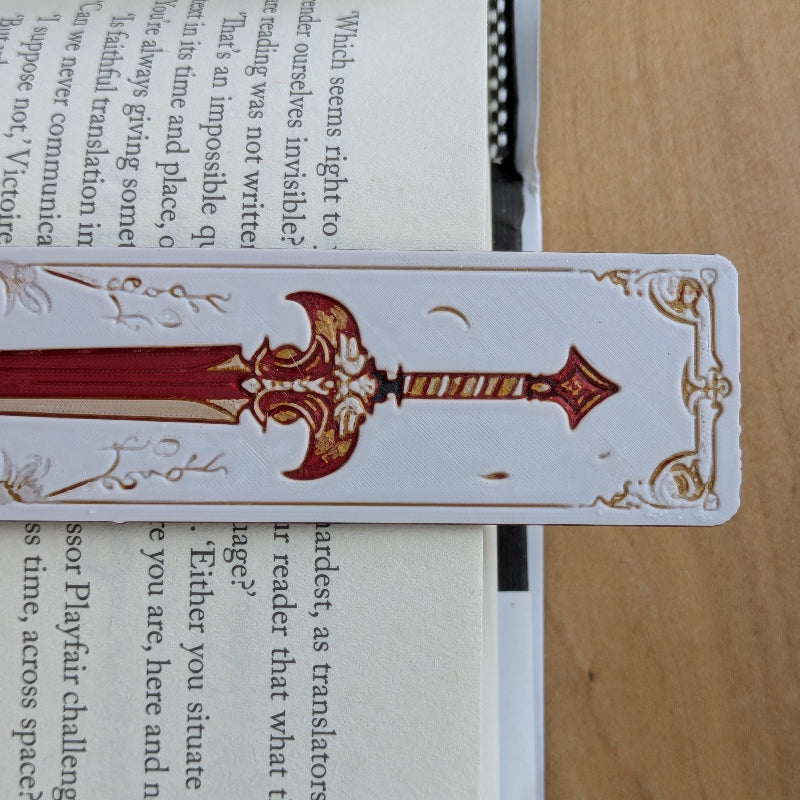 Close-up of textured sword illustration bookmark with ornate medieval detailing