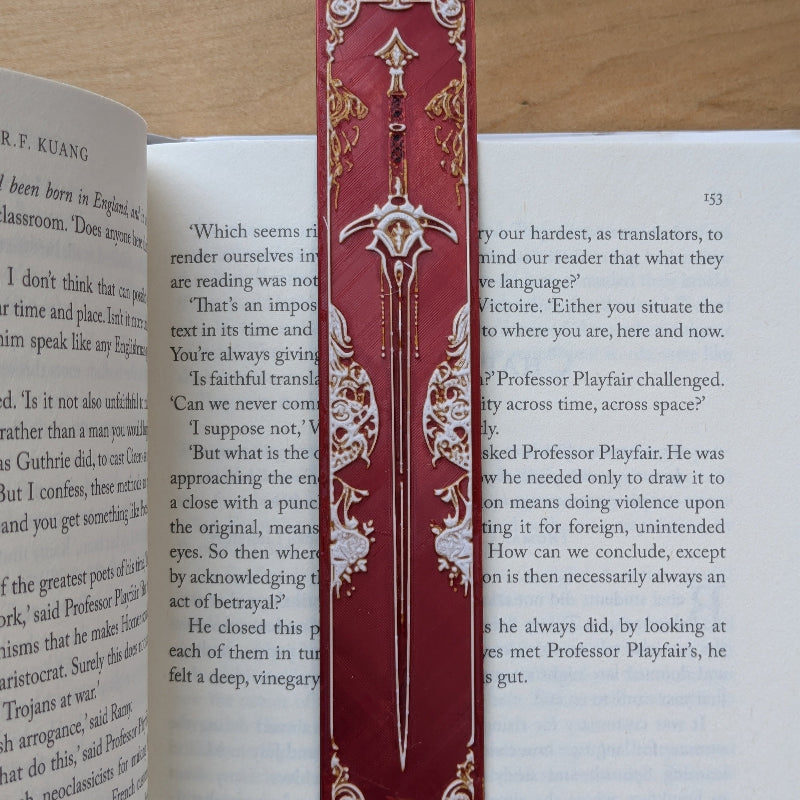 Gothic crimson sword bookmark inspired by medieval illuminated manuscripts