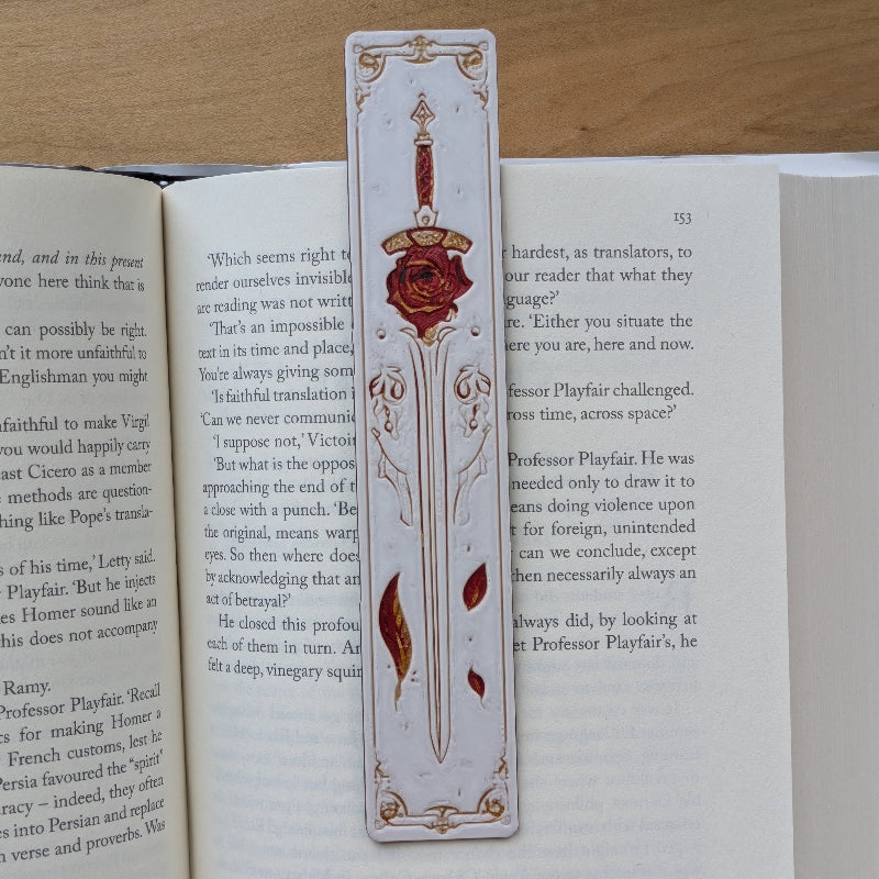 Medieval rose sword bookmark with ivory background and red detailing
