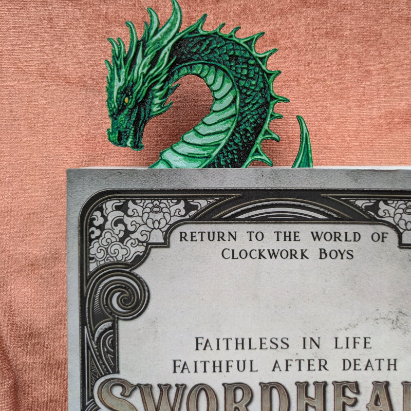 green dragon bookmark resting inside a book
