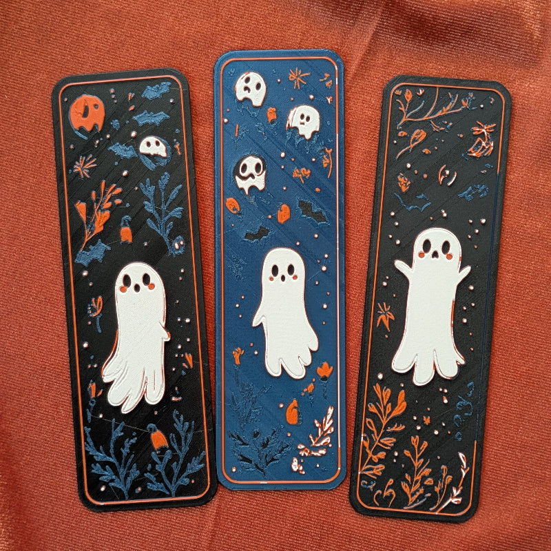 Set of three ghost art bookmarks featuring original ghost illustrations with autumn botanicals for readers, book lovers, and folklore enthusiasts.