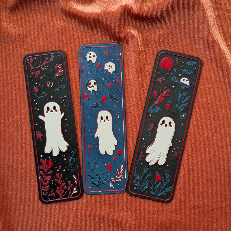 Three handcrafted ghost bookmarks displayed together as a collectible reading set.