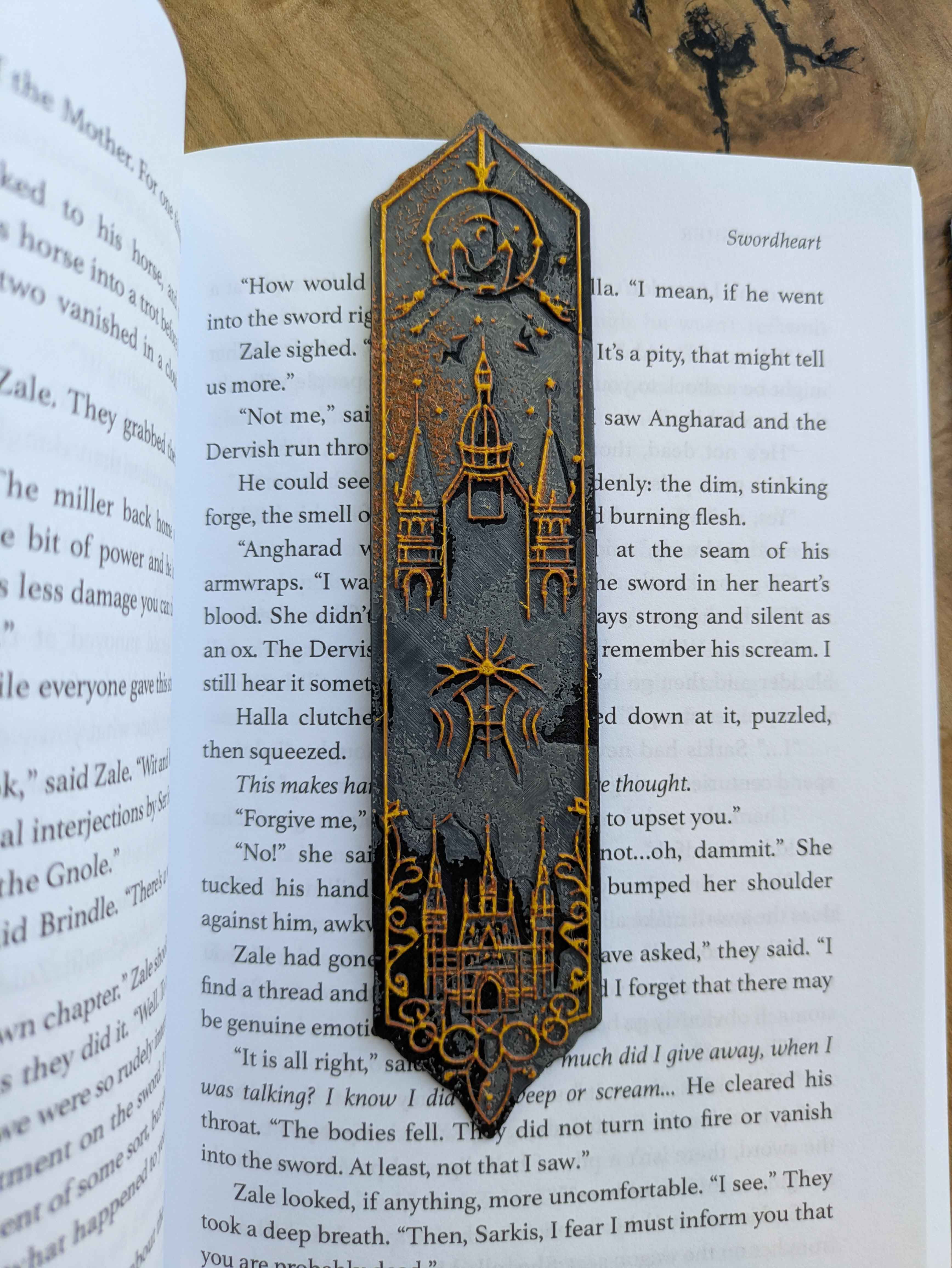 Handcrafted black bookmark with gold accents featuring a full moon and castle design.