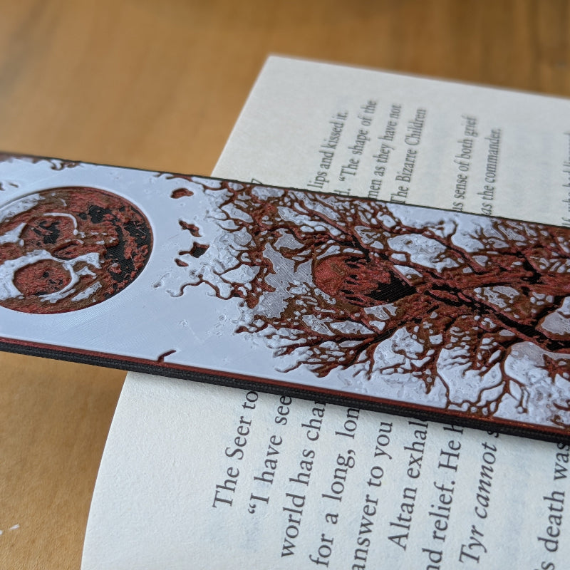 Close up of textured full moon and tree branch detail on gothic bookmark