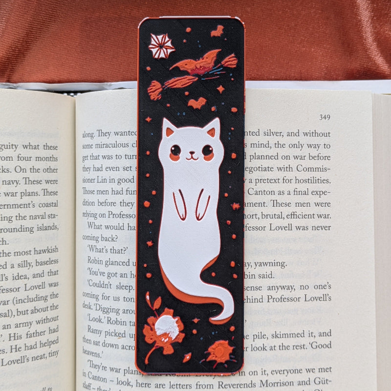 Ghost cat illustrated bookmark on dark background
