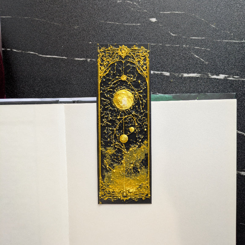 Gilded Celestial Map Moon bookmark with full moon, stars, orbital lines, and ornate gold detailing
