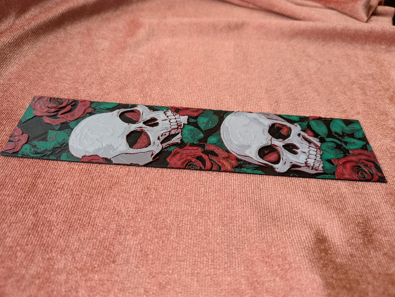 Close-up detail of textured gothic skull and rose bookmark set artwork