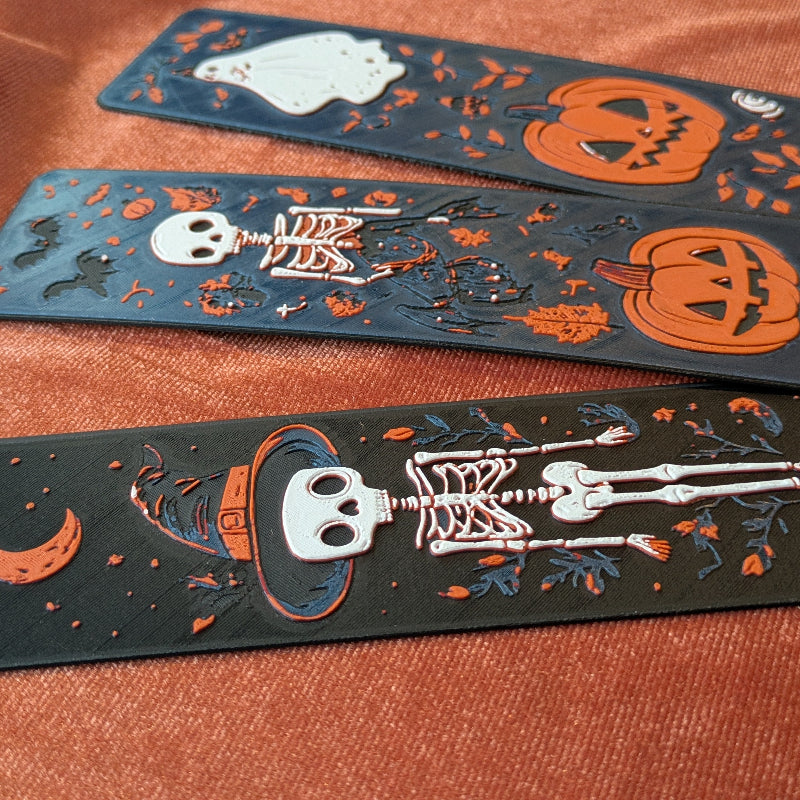 Close up of raised 3D printed texture on Halloween folklore bookmark trio