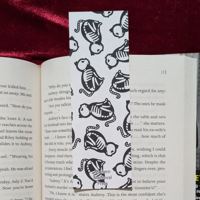 Back of medieval cat skeleton bookmark with clean paper finish