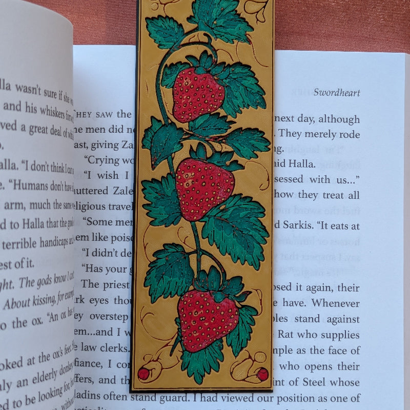 Folklore inspired strawberry vine bookmark with raised texture and handcrafted medieval style detailing