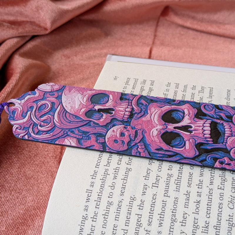 Close-up detail of pink skull folklore bookmark artwork inspired by medieval ornament