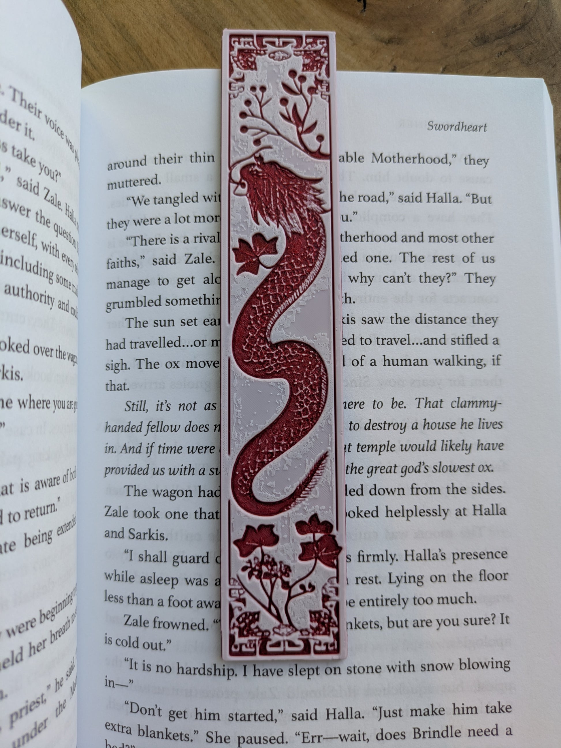 A single red dragon bookmark with intricate detailing.