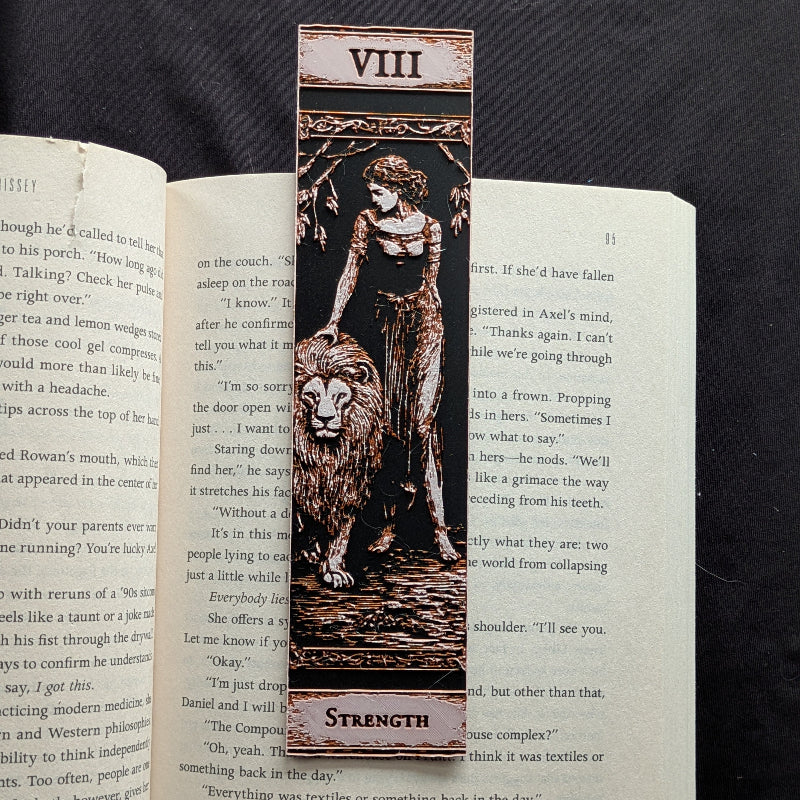 Classic Edition Strength VIII tarot bookmark showing a woman beside a lion in textured, dimensional artwork.