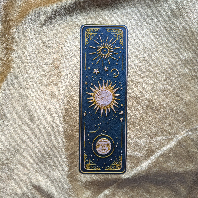 Sun and Moon navy bookmark with raised celestial details and gold accents