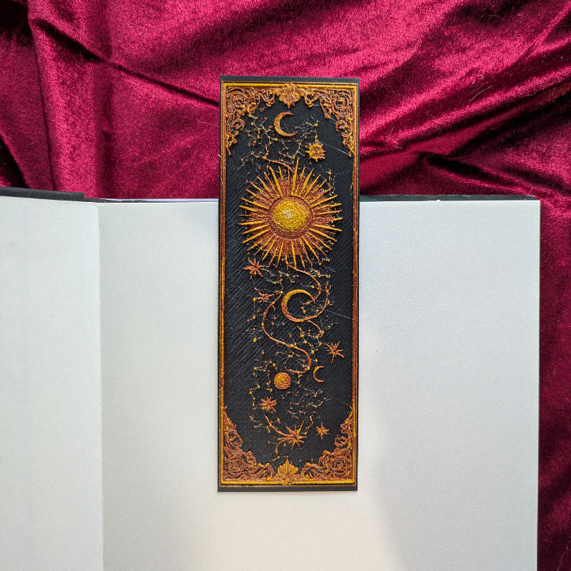 Sun and Moon celestial bookmark with dimensional gold ornament, stars, and crescent moons