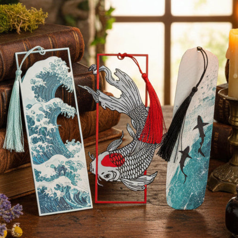 Three Sea Calls, Unfortunately bookmarks featuring blue waves, a red-accented koi fish, and sharks in ocean water.