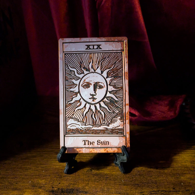 The Sun tarot bookmark in the Collector Edition showing the traditional sun face and radiating rays