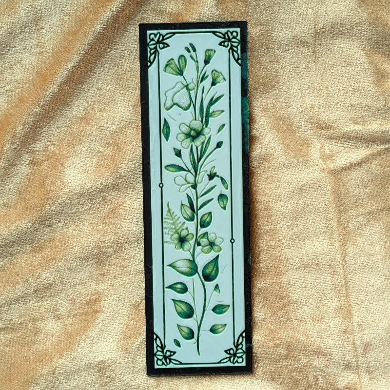 Close-up detail of Verdant Vine bookmark highlighting layered foliage artwork and decorative corners.
