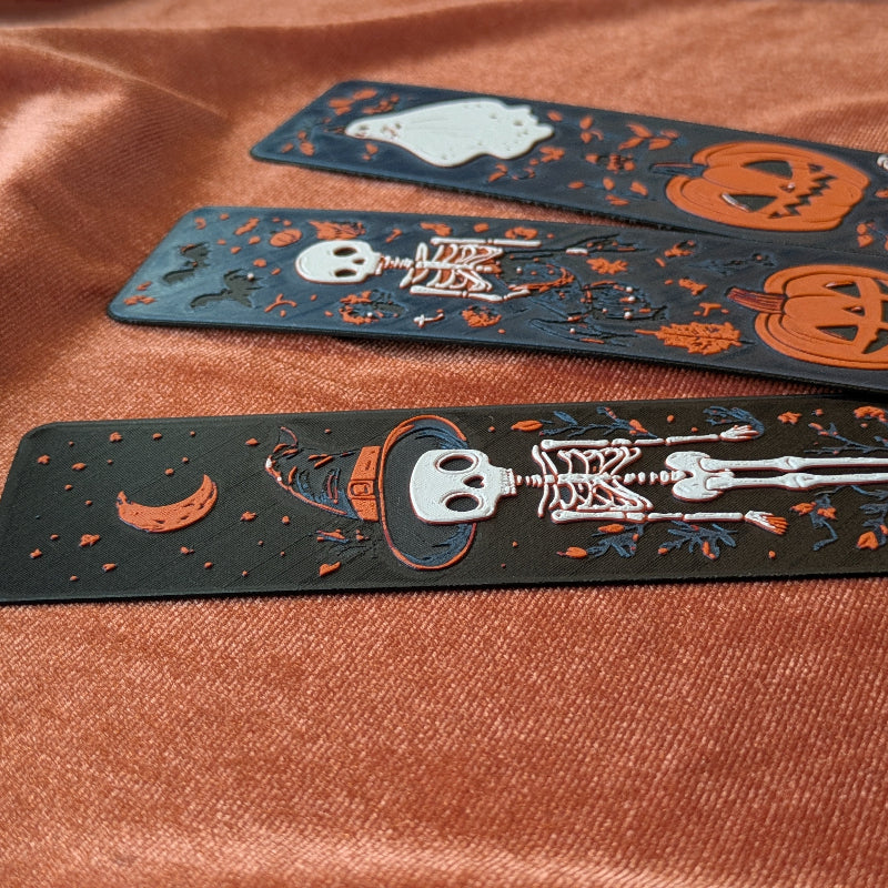 Close up of raised skeleton and crescent moon details on 3D printed bookmark